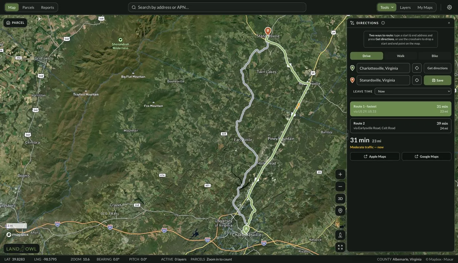 Land Owl map with the Directions panel open: a route drawn on satellite imagery between two Virginia towns, with Drive, Walk and Bike options, start and end address fields, two alternative routes listed with times and distances, a 31 min / 23 mi summary, a moderate-traffic note, and Apple Maps and Google Maps handoff buttons.